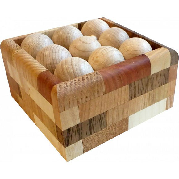 Try-Ball 332 mechanical puzzle by VINCO, featuring a wooden box containing multiple spherical pieces designed for engaging problem-solving play. The box showcases a variety of wood textures and colors, enhancing its visual appeal as a creative and functional toy.