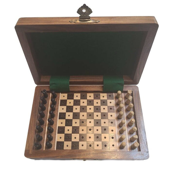 A wooden chess set measuring 4x6 inches, featuring a foldable box with a green velvet lining. The chess pieces are pegged for easy storage, displayed neatly on one side of the board. The board has alternating light and dark squares, providing a classic look for an elegant game.