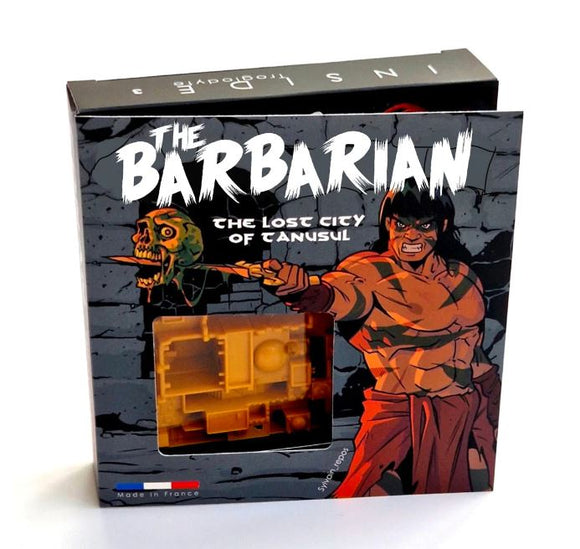 Inside 3 Troglodyte Barbarian is a mechanical puzzle featuring an illustrated cover with a muscular barbarian character and a skull. The packaging highlights an adventure theme, enticing puzzle enthusiasts to explore the 'Lost City of Tanusil'.