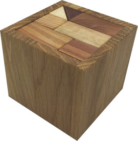 A wooden mechanical puzzle called Two and Half by VINCO. It features a cube shape with a top surface composed of various tessellating wooden pieces in different shades, designed to challenge the mind and enhance problem-solving skills. Ideal for puzzle enthusiasts and as a decorative piece.
