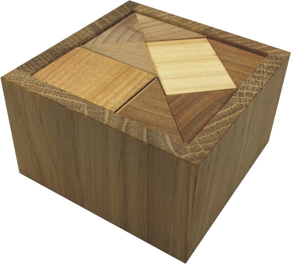 The Mini AC3 Mechanical puzzle by VINCO, featuring a wooden box with a geometric design on the lid made from various shades of wood. The puzzle consists of interlocking pieces that fit together in a square formation, showcasing intricate craftsmanship and natural wood textures.