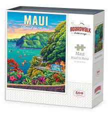 Maui Road to Hana jigsaw puzzle by Dowdle Folk Art. The box features a vibrant illustration of colorful landscapes, lush greenery, and coastal views of Maui. It includes 500 puzzle pieces, ideal for families and puzzle enthusiasts.