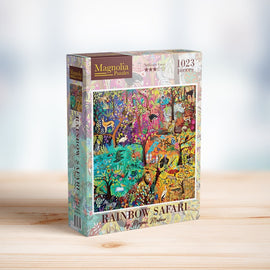 Rainbow Safari jigsaw puzzle by Magnolia Puzzles featuring a vibrant and colorful illustration with animals, trees, and vibrant landscapes. The box displays 1023 pieces, ideal for puzzle enthusiasts.