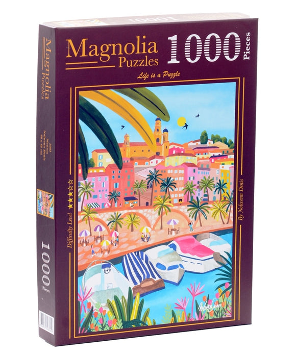 Magnolia Puzzles presents the MENTON jigsaw puzzle. This 1000-piece puzzle features a vibrant seaside scene with colorful buildings, palm trees, and boats. The box showcases the artwork by Nohemi Davis with a difficulty level of 1 star, appealing to casual puzzlers and enthusiasts alike.