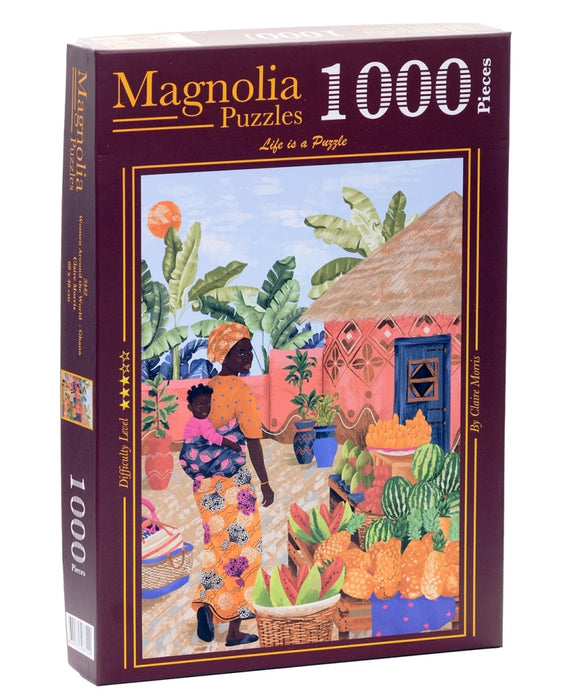 A jigsaw puzzle box from Magnolia Puzzles, titled 'Women Around the World, Ghana'. The design features vibrant artwork depicting a Ghanaian woman carrying a child and surrounded by colorful fruits and plants. The puzzle contains 1000 pieces and is designed by Claire Morris.
