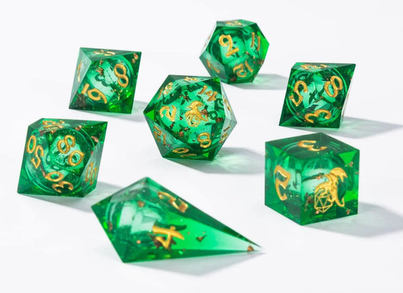 A vibrant Green Liquid Core Sharp Edge Dice Set by Hymgho, featuring seven intricately designed polyhedral dice. Each die showcases a clear green resin body with gold numbers and ornate designs embedded within, perfect for tabletop gaming enthusiasts.