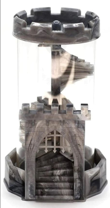 A gray dice tower designed as a castle, featuring a spiral staircase inside. The tower has intricate details including battlements at the top and a rounded base, creating a unique aesthetic for tabletop gaming.