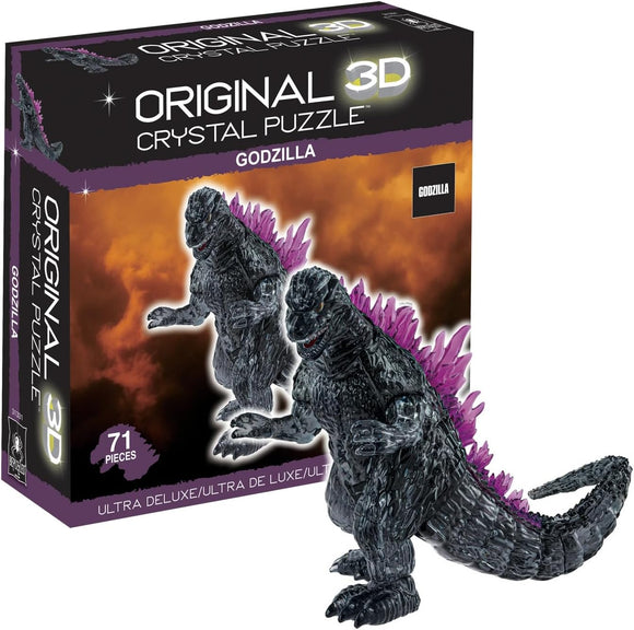 A 3D crystal puzzle of Godzilla, featuring a detailed design with black and purple elements. The puzzle comes in a box labeled "Original 3D Crystal Puzzle" and contains 71 pieces, perfect for fans and collectors.