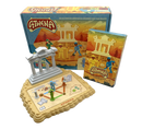 Athena, a mechanical puzzle game by Project Genius, featuring an intricate board game set on a sandy terrain. It includes three colorful figurines, obstacle pieces, and a booklet with challenge cards. The game is designed to stimulate critical thinking and problem-solving skills, set against a backdrop of ancient Greek architecture.
