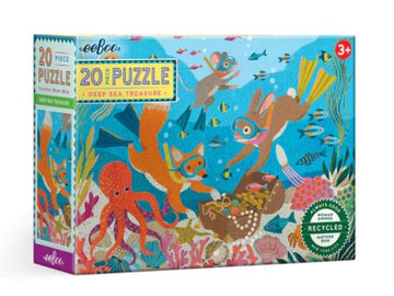 Eeboo Deep Sea Treasure 20pc Jigsaw Puzzle box featuring vibrant underwater scene with colorful fish, sea creatures, and a treasure chest surrounded by coral. Designed for children aged 3 and up with an emphasis on eco-friendly materials.