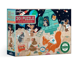 Eeboo Space Exploration 20Pc Puzzle featuring adorable animals in spacesuits exploring a colorful alien landscape with a rocket ship. The box showcases a vibrant illustration of squirrels, mice, and other woodland creatures engaged in space activities. Perfect for children, this eco-friendly puzzle provides imaginative fun and educational engagement.