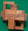 The Ozone Burr Puzzle by Pelikan Puzzles is a meticulously crafted wooden mechanical puzzle. It features interlocking pieces in various solid wood shades, showcasing a unique design that challenges the mind and promotes problem-solving skills. Ideal for puzzle enthusiasts and those seeking a creative challenge.