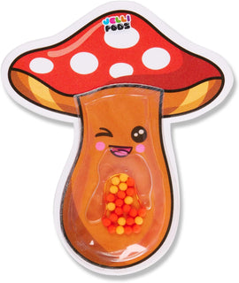 A colorful Jelli Pods Mushroom toy by Buffalo Games featuring a smiling face. The mushroom design is primarily orange with a red cap adorned with white polka dots. Inside, it contains small colorful balls that can be moved around, providing a fidgeting experience.