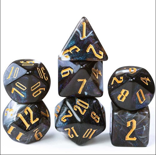A beautifully crafted set of RPG dice from Foam Brain Games, featuring six polyhedral dice with a glossy black finish and shimmering gold numbers, including a d20, d12, d10, d8, d6, and d4, arranged in a visually appealing stack.