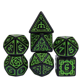 A vibrant display of Cryptic Knots Verdant RPG Dice by Foam Brain Games, featuring a set of polyhedral dice in black with vivid green inscriptions. The collection includes various shapes, showcasing their unique designs and numbers, perfect for tabletop gaming enthusiasts.