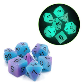 Glow in the Dark Supernova game featuring a set of vibrant, translucent dice in shades of blue and purple. The dice feature clear black numbering and glow brightly in the dark, perfect for nighttime gaming sessions.