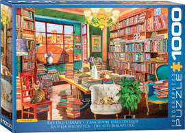The Old Library jigsaw puzzle by Eurographics, featuring a vibrant indoor scene filled with colorful bookshelves, a cozy chair, and a serene atmosphere. The puzzle showcases a view from the window of the library, complete with a bright chandelier and decorative elements, providing an inviting setting for book lovers and puzzle enthusiasts alike.