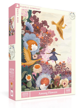 The box of a 500-piece jigsaw puzzle titled 'Among Flowers' by New York Puzzle Company featuring a whimsical illustration of a girl among colorful flowers and flying birds, showcasing vibrant hues of pink, orange, and blue.