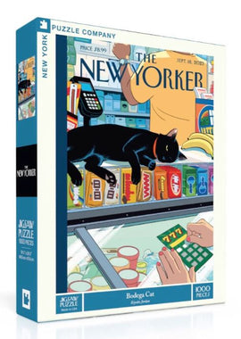 The Bodega Cat jigsaw puzzle box features an illustration of a black cat lounging atop a grocery store counter, surrounded by colorful products. The design reflects a lively bodega scene, capturing the essence of urban life. The puzzle consists of 1000 pieces and showcases art by Kyril Jordan, making it a vibrant addition to any puzzle collection.