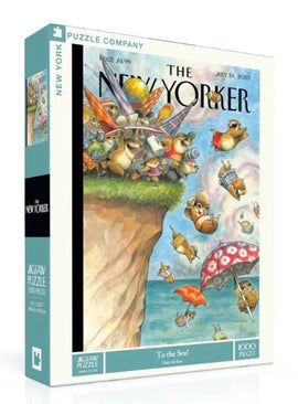 The New Yorker jigsaw puzzle titled 'To The Sea' featuring whimsical cartoon animals preparing for beach fun, with vibrant colors and intricate details. The illustrated cover showcases a variety of characters engaging in playful activities near the ocean, making it an entertaining and visually appealing puzzle with 1000 pieces.