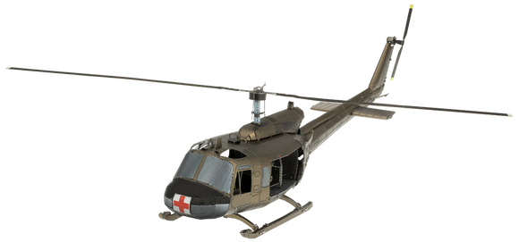 A detailed metal model of a UH-1 Huey Helicopter from Metal Earth by Fascinations. The helicopter features intricate components including a sleek body, rotor blades, and a distinct red cross insignia.
