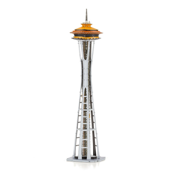 A detailed model of the iconic Space Needle, originally showcased at the 1962 World's Fair in Seattle. The structure features a sleek silver base with an orange-topped observation deck, showcasing intricate design elements.
