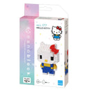Nanoblock Hello Kitty V.2 DIY kit featuring a detailed micro-brick model of Hello Kitty. The model displays Hello Kitty wearing a blue outfit with yellow accents and a signature red bow on her head. The packaging is colorful with hearts, showcasing the product designed for ages 12 and up, and contains 140 pieces.