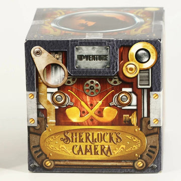 Cluebox - Sherlock's Camera Escape Room Box by IDventure, featuring a detailed mechanical design with brass accents and vintage imagery, perfect for puzzle enthusiasts. The box showcases a steampunk aesthetic with gears and pipes, encapsulating the mystery of a Sherlock Holmes theme.