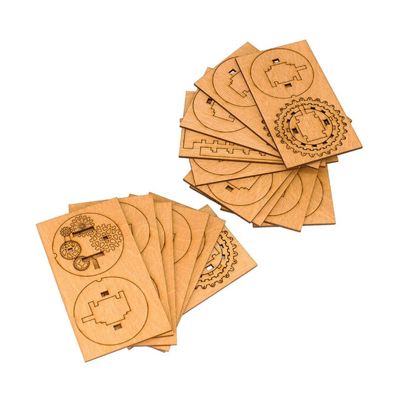 A collection of intricately designed wooden pieces from the Kryptos Cryptex Wooden Kit by IDventure, featuring puzzle-like shapes and mechanical gears. The pieces are displayed in a scattered arrangement, showcasing their craftsmanship and detail.