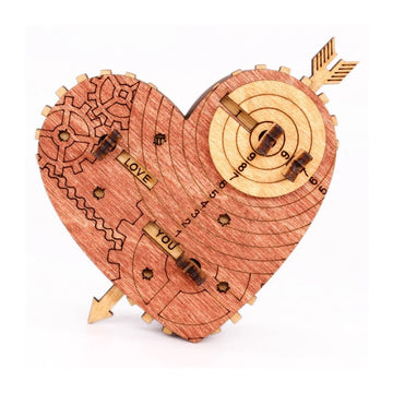 A beautifully crafted mechanical heart-shaped puzzle by IDventure, featuring intricate gears and engraved messages that say 'LOVE' and 'YOU'. The wooden construction showcases a warm, natural finish with detailed designs, making it visually appealing and a perfect gift for puzzle lovers and romantics alike.