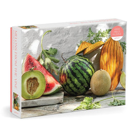 Jigsaw puzzle titled 'Melons from the Vine' by Galison, featuring a colorful assortment of melons including watermelon, cantaloupe, and honeydew, beautifully displayed on a textured white background. The puzzle contains 1000 pieces, inviting puzzle enthusiasts to enjoy a vibrant and refreshing challenge.