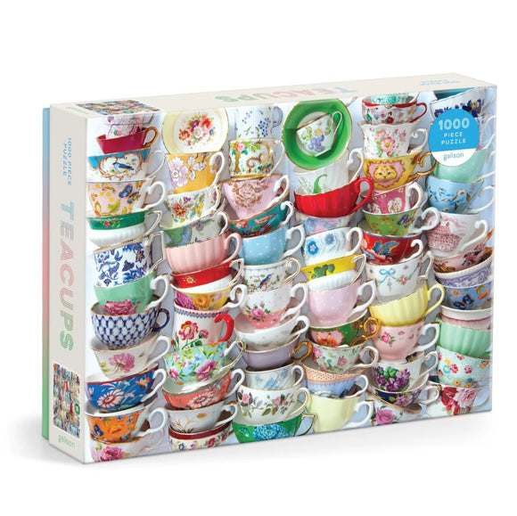 Galison 1000-piece jigsaw puzzle featuring a vibrant arrangement of beautifully designed teacups, showcasing various floral patterns and colors. The puzzle box highlights the intricate details of the teacups, perfect for tea lovers and puzzle enthusiasts alike.