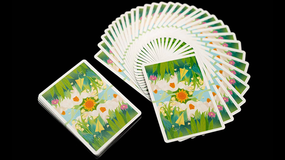 A vibrant deck of playing cards titled 'Early Summer Trip' by Murphy's Magic. The cards feature a colorful design with flowers, greenery, and a bright sun, elegantly fanned out with a few stacked. Perfect for family game nights or casual gatherings.