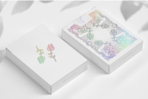 Innocence Holographic Playing game by WJPC, featuring a beautifully designed box with a holographic cover and floral motifs. Packaging is elegant with soft pastel colors, showcasing intricate illustrations, perfect for game nights.