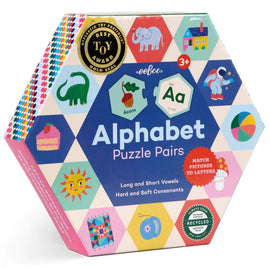 Eeboo's Alphabet Puzzle Pairs is a colorful jigsaw puzzle designed for children 3 and up, featuring playful illustrations of letters, animals, and objects. The hexagonal box displays matchable pairs that teach long and short vowels alongside hard and soft consonants, promoting early literacy skills through engaging gameplay.