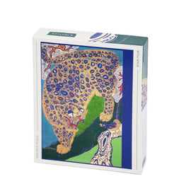 A vibrant jigsaw puzzle box titled 'Peacock Tiger' by Kinstler. The packaging features an artistic depiction of a leopard with colorful patterns against a green and blue background, designed for engaging puzzle enthusiasts.