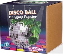 A 4-inch Disco Ball Hanging Planter designed to resemble a classic disco ball, featuring a shiny mirrored surface that reflects light. It is suitable for houseplants and adds a fun, retro vibe to any room. The packaging showcases vibrant colors with a disco-themed background and text promoting the planter.