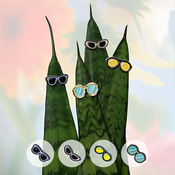 A whimsical display of the Plant Magnet 4 Sunglasses by Eufolia, featuring sunglasses on vibrant green leaf illustrations. The image shows four pairs of sunglasses perched on the tips of slender leaves, accompanied by three additional pairs of sunglasses in a circular arrangement at the bottom of the image, showcasing various colors and styles.