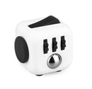 A Fidget Cube from Antsy Labs, featuring various tactile buttons and switches in black and silver on a white cube. This stress-relief toy is designed for sensory engagement and focus.