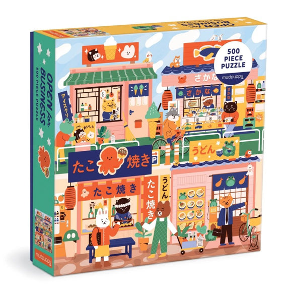 The Open for Business jigsaw puzzle by Mudpuppy features a vibrant illustration of animal characters operating various food stalls, including u-don and takoyaki. The colorful artwork showcases a lively market scene with adorable illustrations and 500 pieces for engaging entertainment.