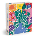 Zodiac Flowers jigsaw puzzle box featuring a vibrant illustration of a vase filled with colorful flowers. The design includes various floral motifs such as sunflowers, pink blossoms, and leafy greens, set against a cream background. The puzzle contains 1000 pieces, ideal for flower lovers and puzzle enthusiasts.