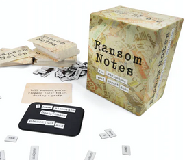 Ransom Notes game by Very Special Games featuring a stylish box with playful typography. Inside are several cards with humorous prompts and letter tiles scattered around, designed for creative wordplay and party fun.
