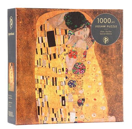 A beautifully designed jigsaw puzzle titled 'The Kiss' by Gustav Klimt, presented in a special edition by Paperblanks. The puzzle box features a reproduction of Klimt's iconic art, showcasing vibrant colors and intricate patterns. It contains 1000 pieces, perfect for both puzzle enthusiasts and art lovers looking to recreate a masterpiece.
