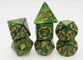 A set of vibrant green RPG dice with golden engravings. The dice include a variety of shapes such as a d4, d6, d8, d10, d12, and d20, each featuring intricate dragon designs and numeric markings. These unique dice are ideal for tabletop role-playing games, bringing an immersive experience for players.