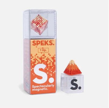The Speks Pixel 1 Up is a visually intriguing magnetic construction kit featuring a pyramid shape made of small colored balls. It comes in a transparent package with a vibrant red and orange design, showcasing its fun and creativity-enhancing potential.