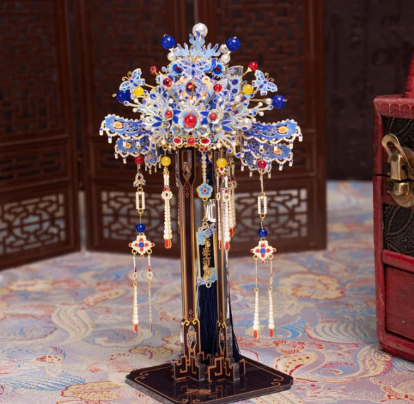 A beautifully crafted stand for Coronet Metal Models, featuring intricate designs and colorful decorations. The stand showcases vibrant beads and detailed craftsmanship, perfect for displaying model creations. It stands on a sturdy base, enhancing the aesthetic appeal of any model collection.