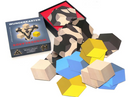 The Wunderkarten - Illusions mechanical puzzle set by MeterMorphosen. It features a colorful array of hexagonal wooden pieces in blue, yellow, and black patterns, scattered around an open black box with a red interior. The pieces are designed for intricate arrangement, promoting creative problem-solving.