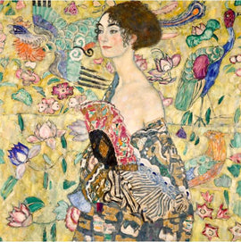 A jigsaw puzzle featuring 'Lady with Fan' by Gustav Klimt. The artwork showcases a woman in profile, adorned with intricate patterns and a colorful fan, surrounded by vibrant flowers and decorative elements, evoking a sense of elegance and artistry.