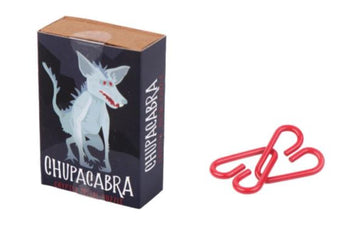 The Cryptid Puzzlebox Chupacabra by Project Genius is a mechanical puzzle featuring a mysterious creature design on its box. The puzzle box is accompanied by colorful red paper clips that are part of the puzzle-solving experience, inviting players to engage in a fun and mysterious challenge.
