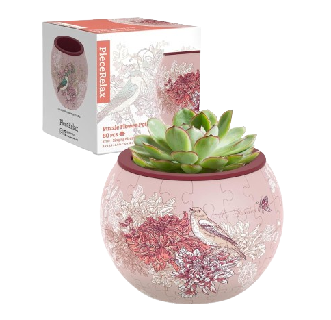 A beautifully designed jigsaw puzzle shaped like a flower pot featuring delicate illustrations of birds and flowers. The puzzle is made of 80 pieces and is displayed with a succulent plant inside, showcasing its unique dual purpose as both a decorative and functional item.